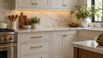 Kitchen with brass cabinet knobs on upper doors and matching brass cabinet pulls on drawers, showing where each hardware type works best.
