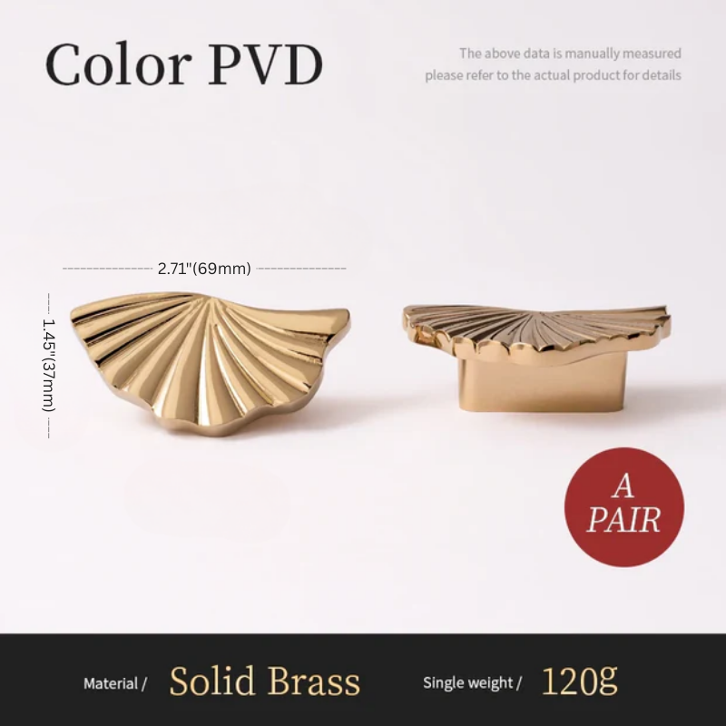 Two gold-colored decorative elements with measurements and material details on a white background