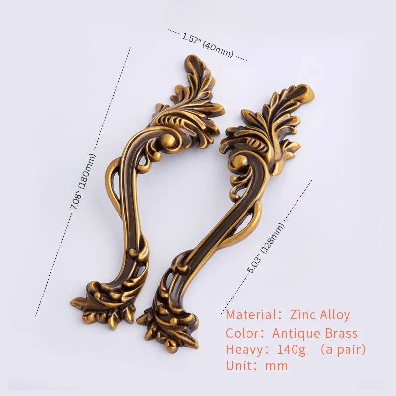 Decorative bronze handles with measurements on a white background