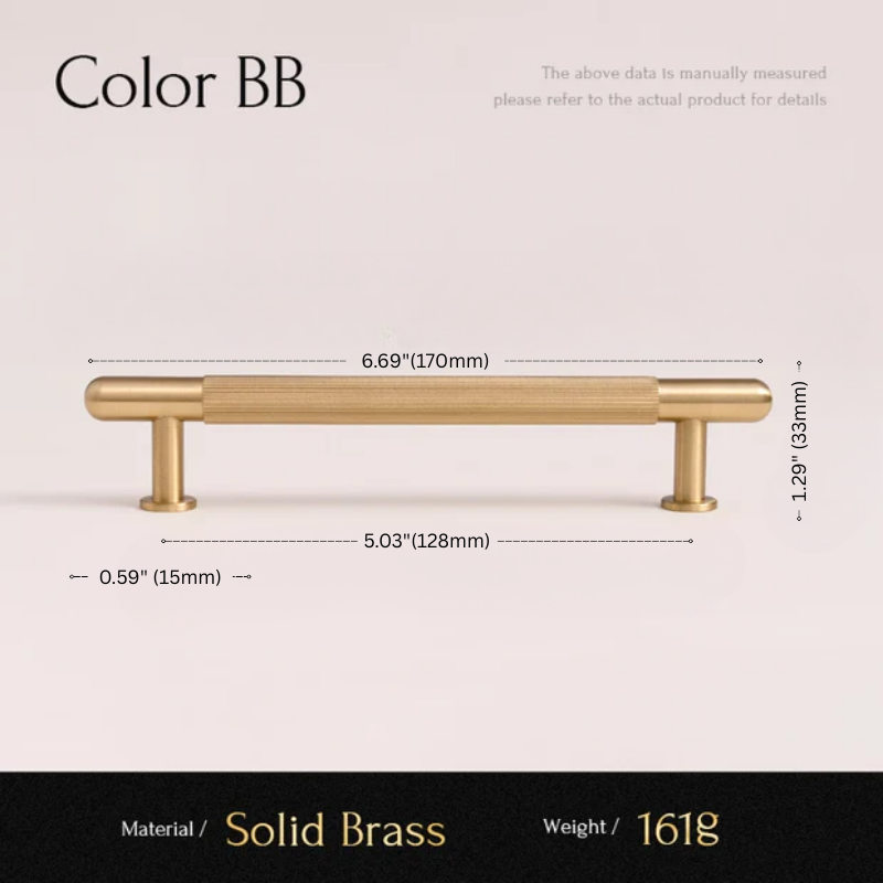 Gold cabinet handle with dimensions and material details on a light pink background