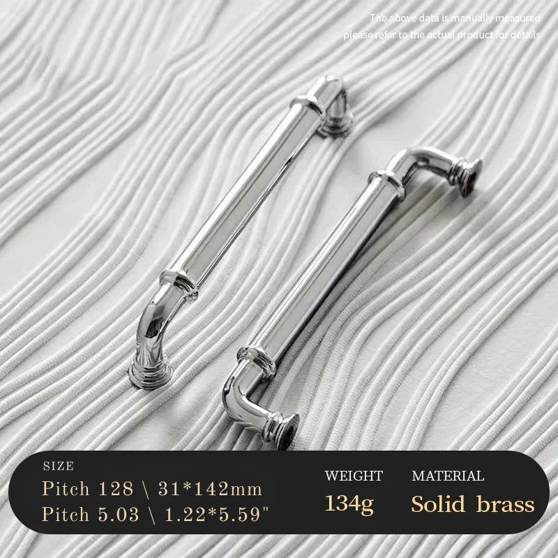 Two solid brass pipes on a textured white background with product details.