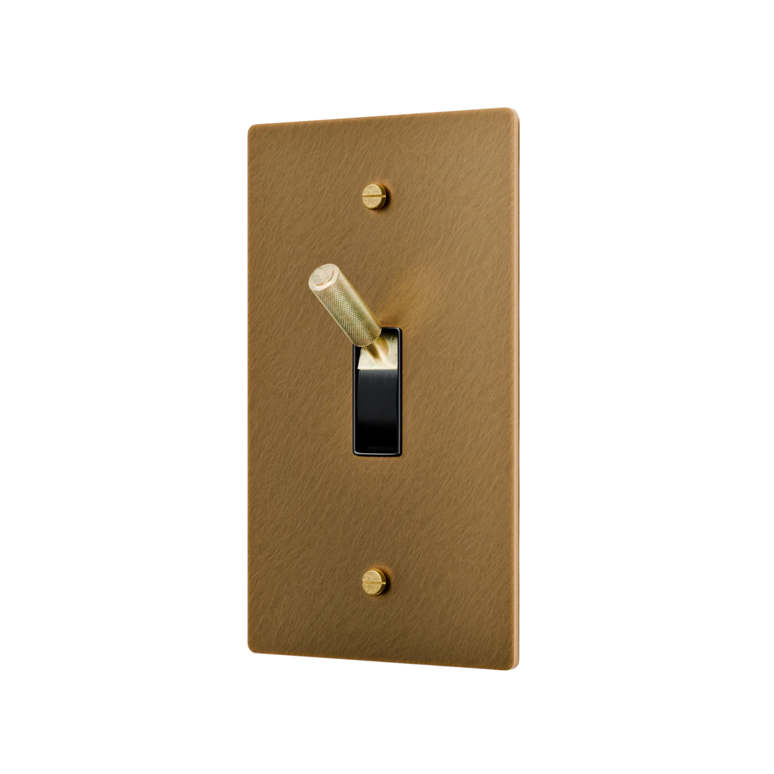 Aged brass light switch plate with a toggle switch on a white background