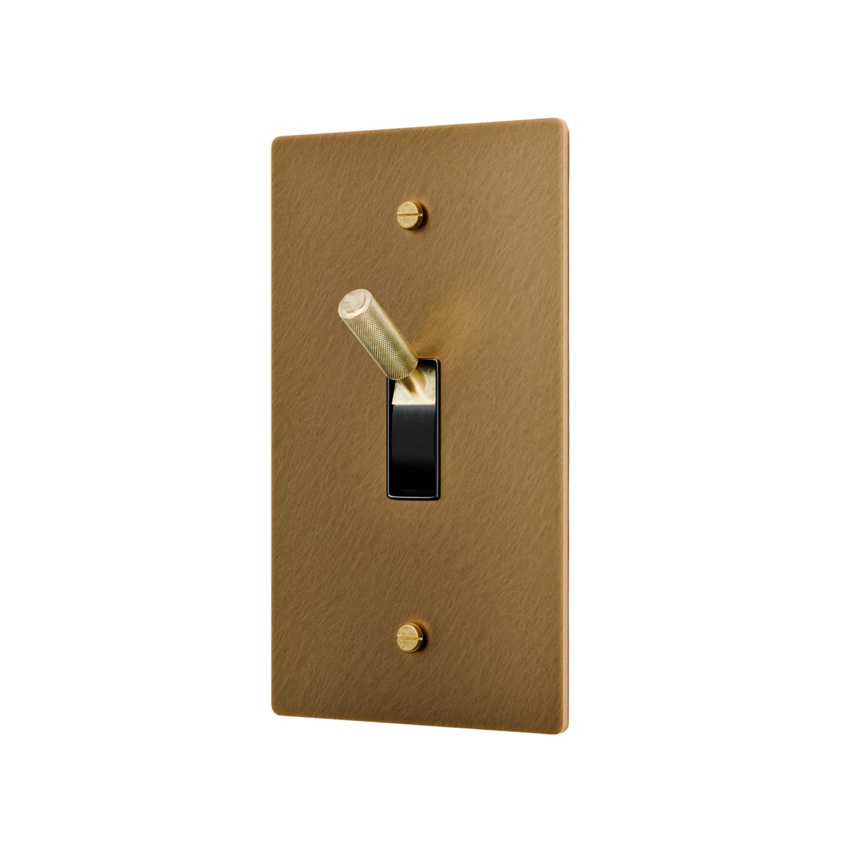 Aged brass light switch plate with a toggle switch on a white background