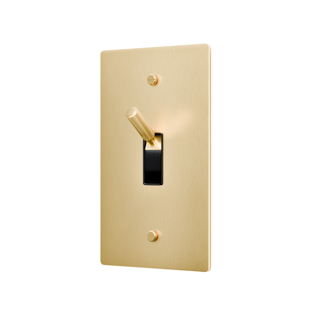 Gold light switch with a black rocker on a white background