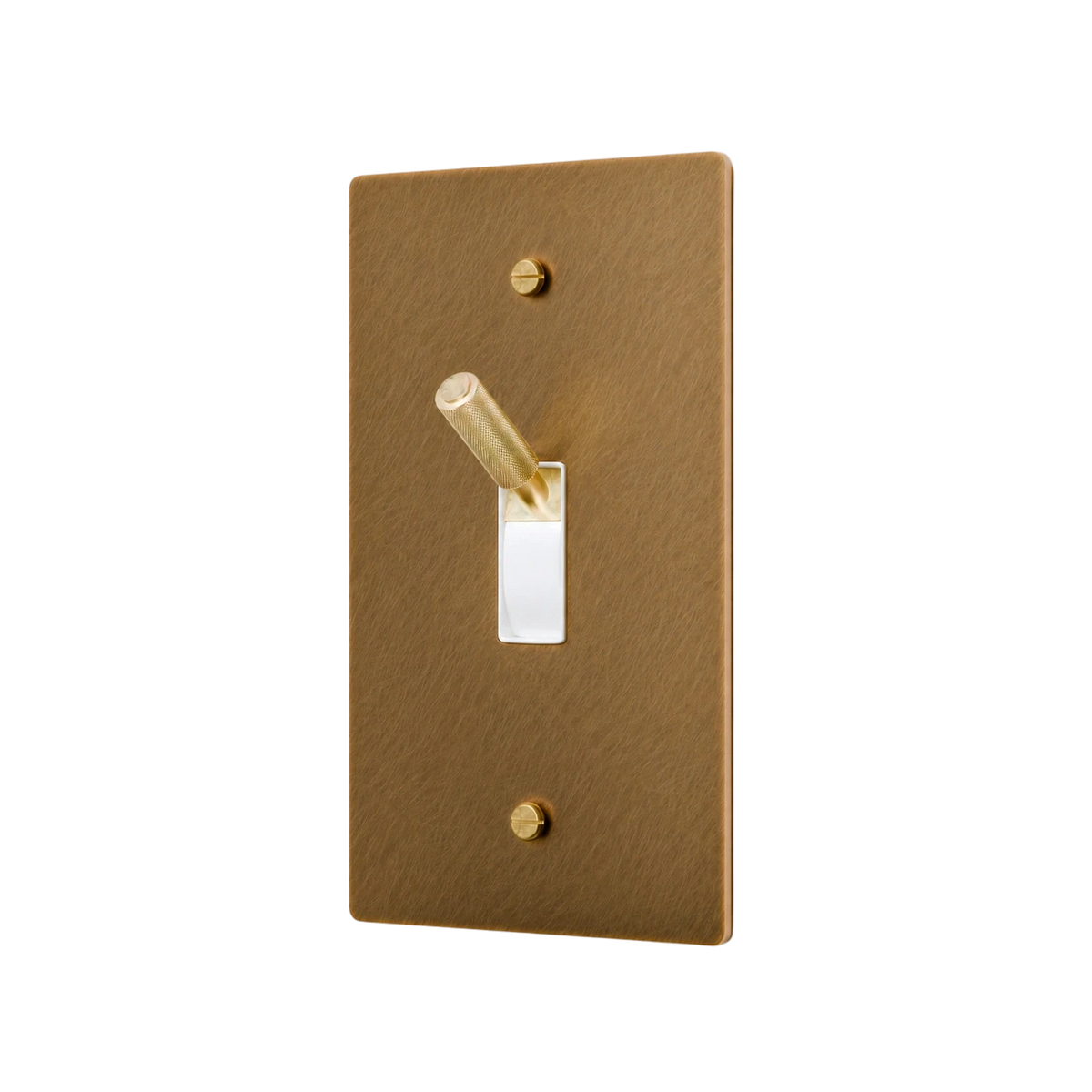 Aged brass-colored light switch cover with a toggle switch on a white background