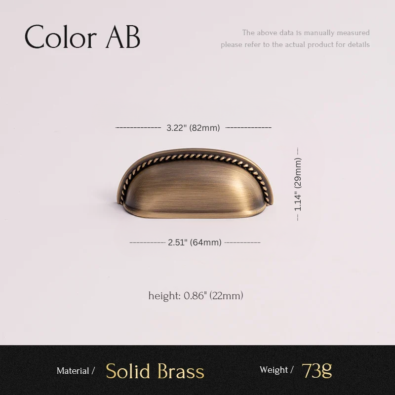 Brass cabinet handle with dimensions and material details on a light pink background