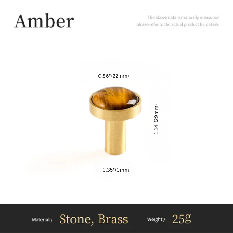 Gold-colored object with amber stone, showing measurements and material details on a white background.