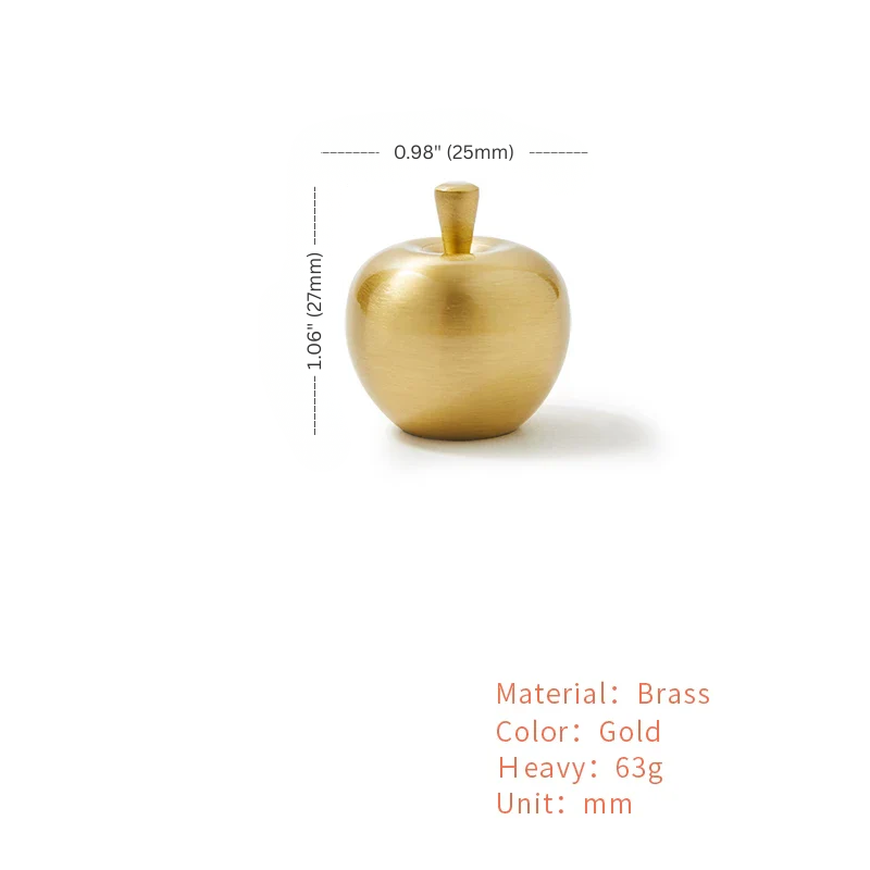 Gold apple-shaped object with measurements on a white background
