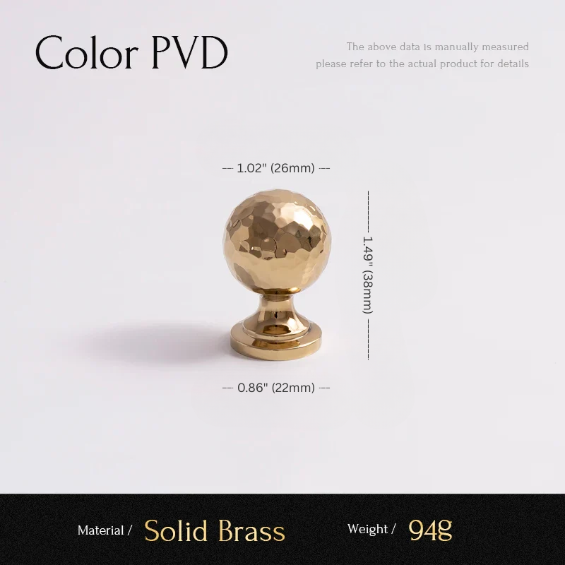 Gold spherical decorative object with measurements on a white background