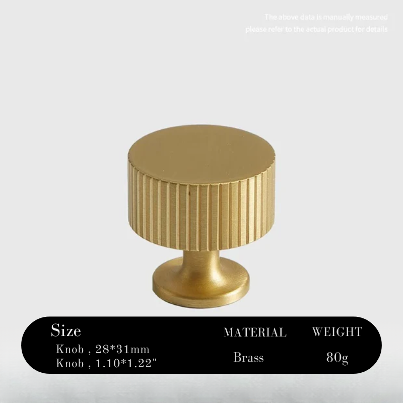 Gold cylindrical knob with ribbed design on a white background