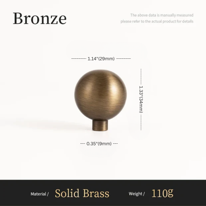 Bronze spherical object with measurements on a white background