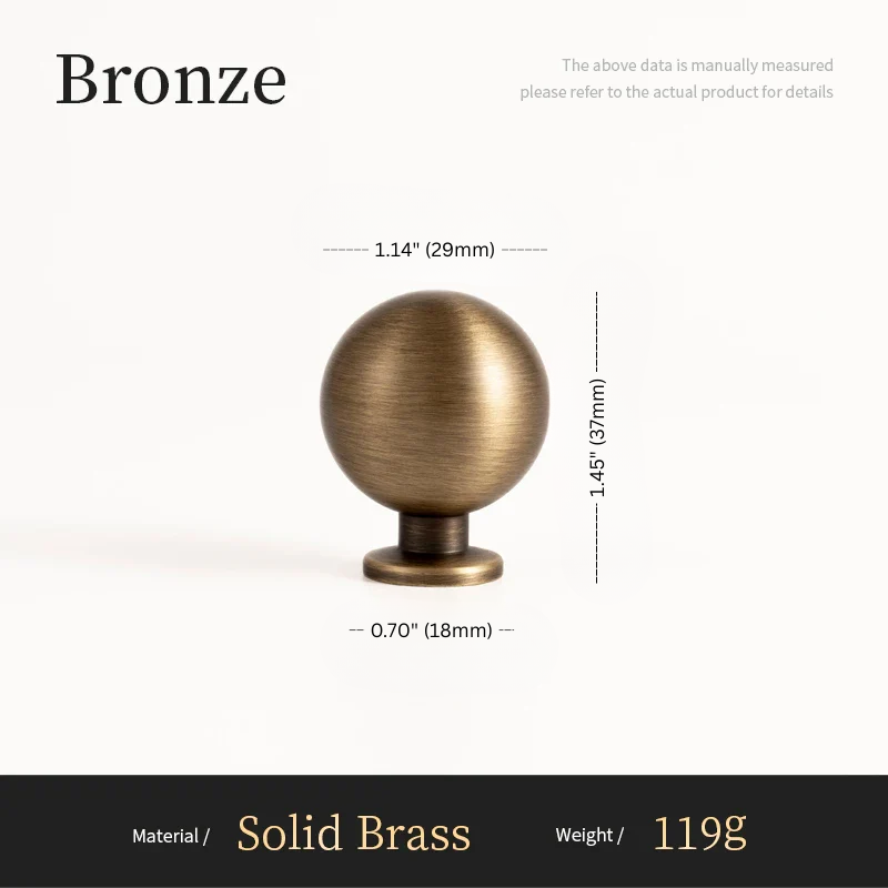 Bronze spherical object with measurements on a white background