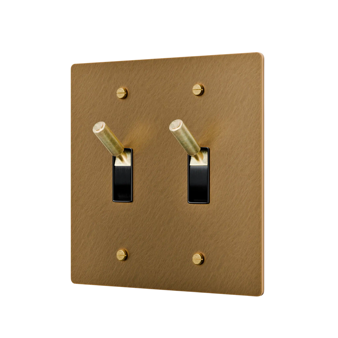 aged brass double toggle switch with black switches on a white background
