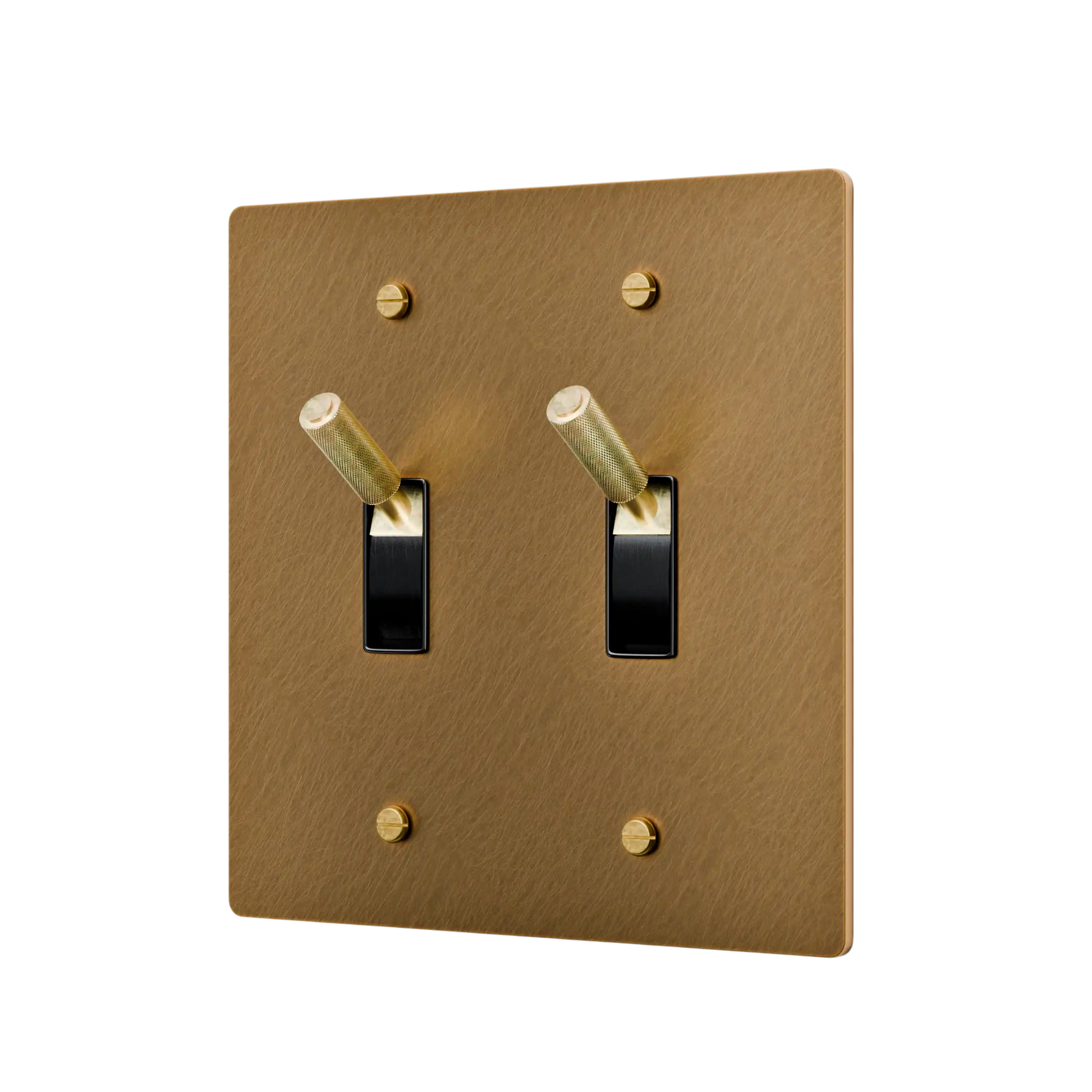 aged brass double toggle switch with black switches on a white background