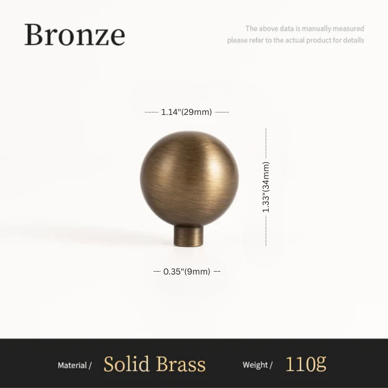 Bronze spherical object with measurements on a white background
