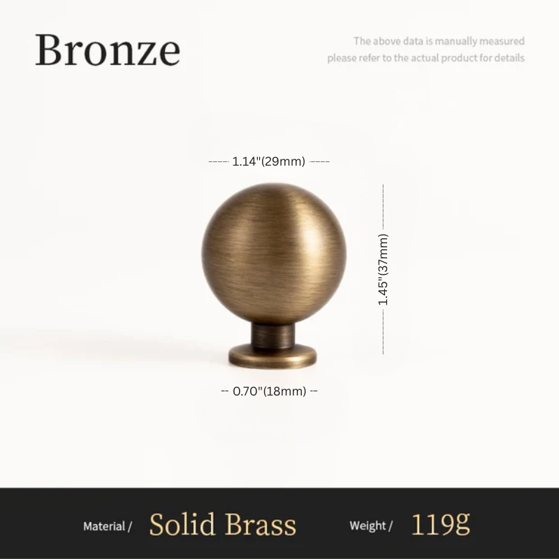 Bronze spherical object with measurements on a white background