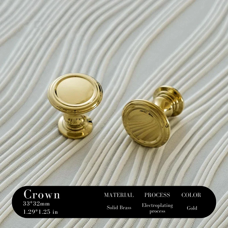 Two gold cabinet knobs on a textured beige background with product details.