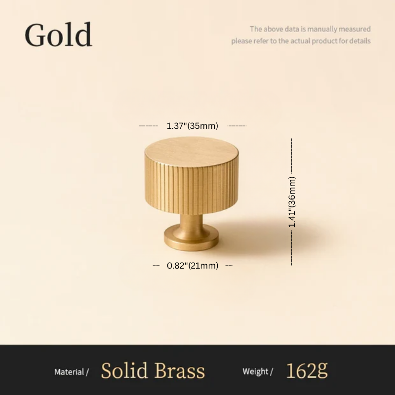 Gold cylindrical object with measurements on a beige background