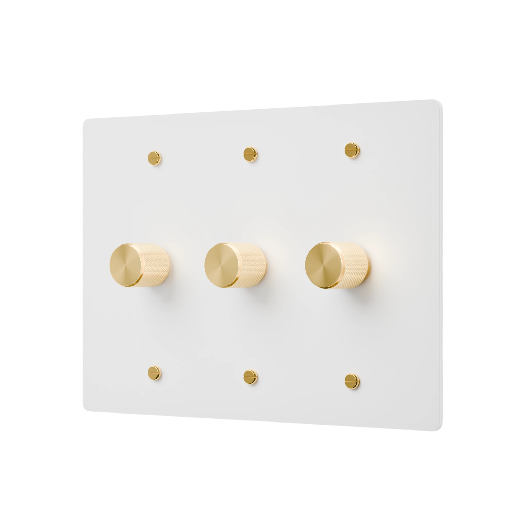 White wall plate with gold knobs on a white background
