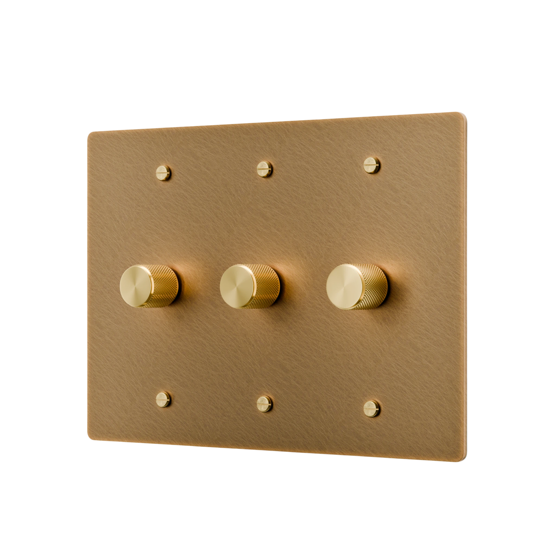 Gold switch panel with three gold knobs on a white background