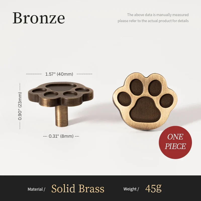 Bronze paw-shaped object with measurements and material details on a white background