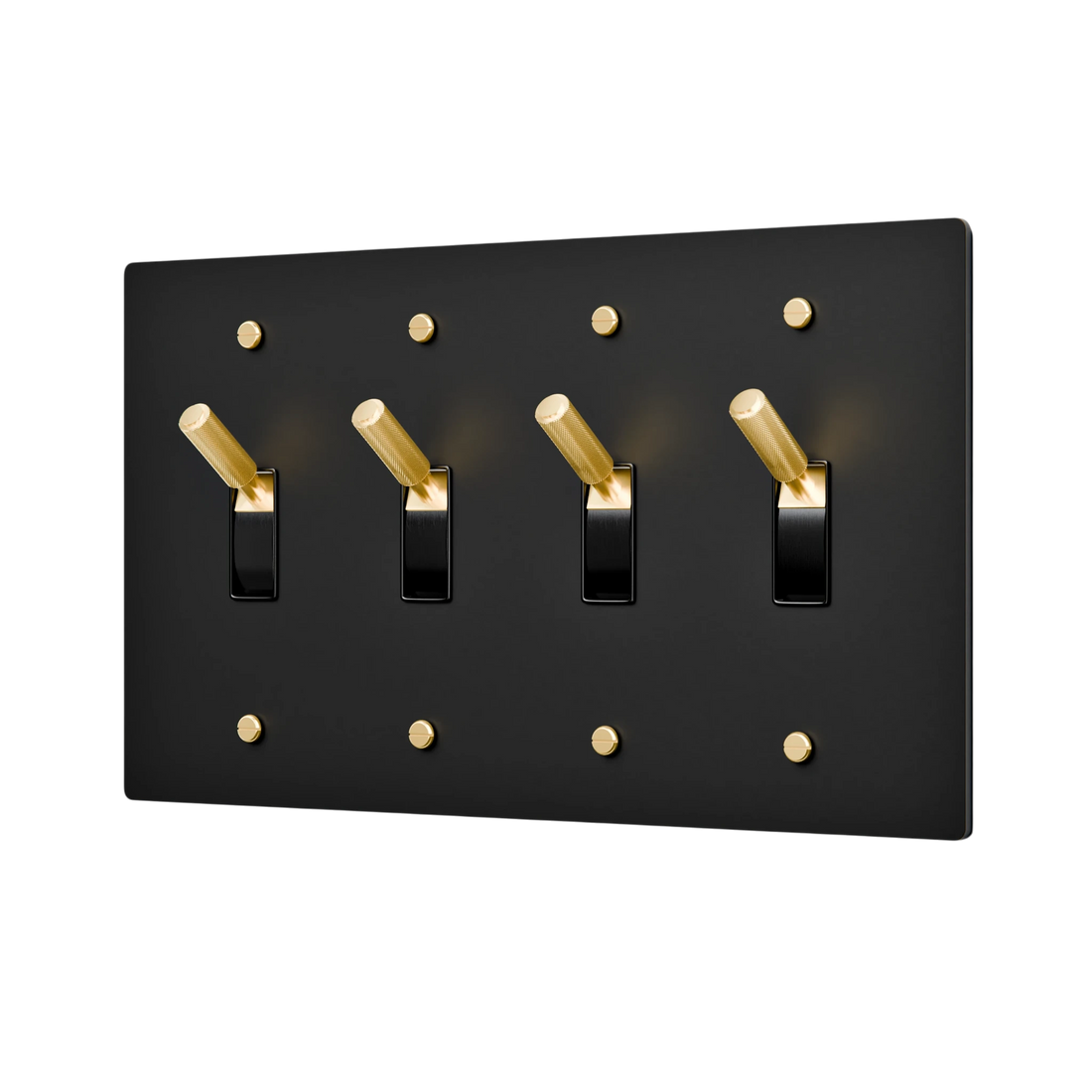 Aged brass light switch panel with four black switches on a white background