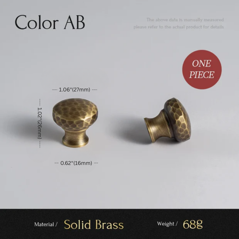 Two brass cabinet knobs with measurements on a gray background