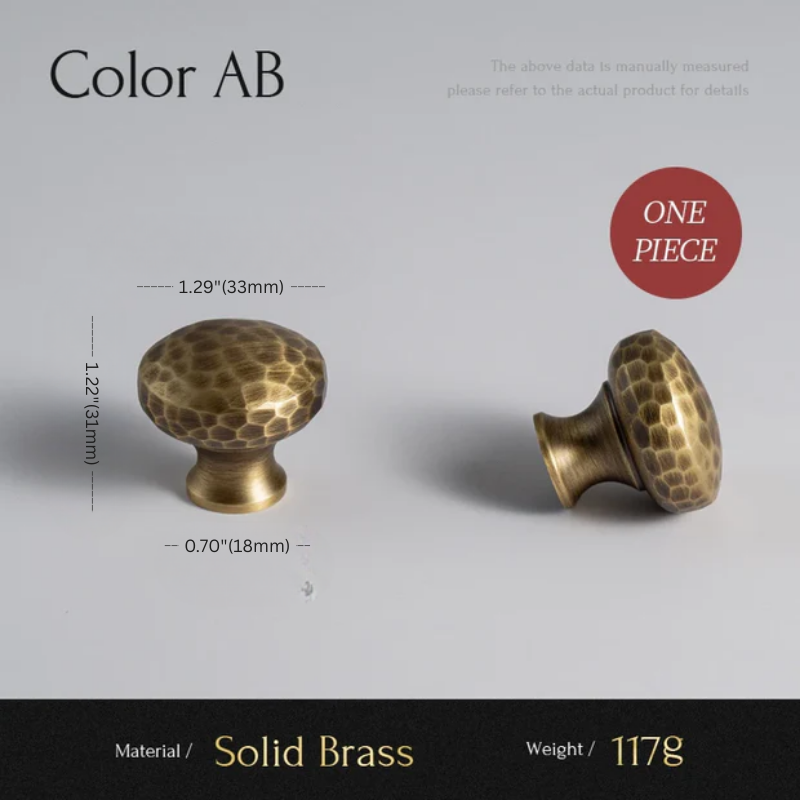 Two solid brass cabinet knobs with measurements on a gray background