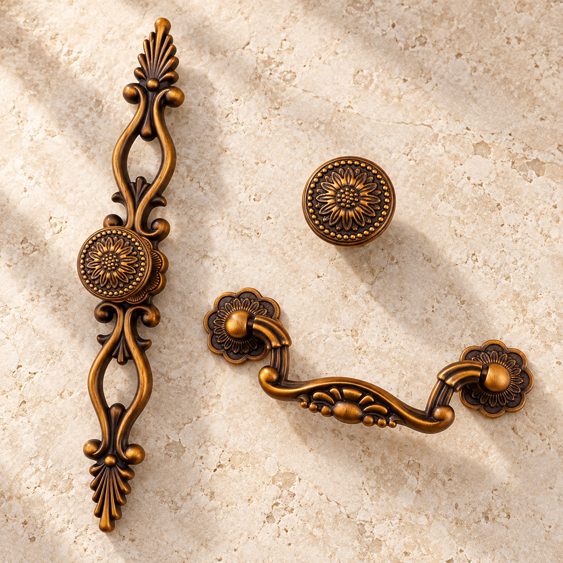 Antique Brass Cabinet Pulls & Knobs — Vintage European Style on a warm ivory background