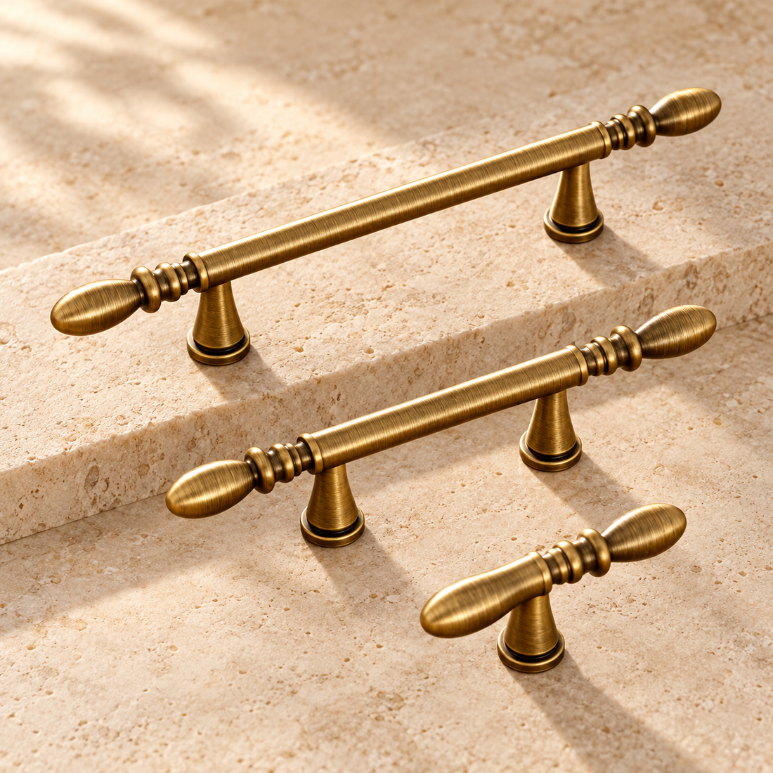 Antique Brass Water-Droplet Cabinet Pulls & Knobs — Luxury Design on warm ivory stone
