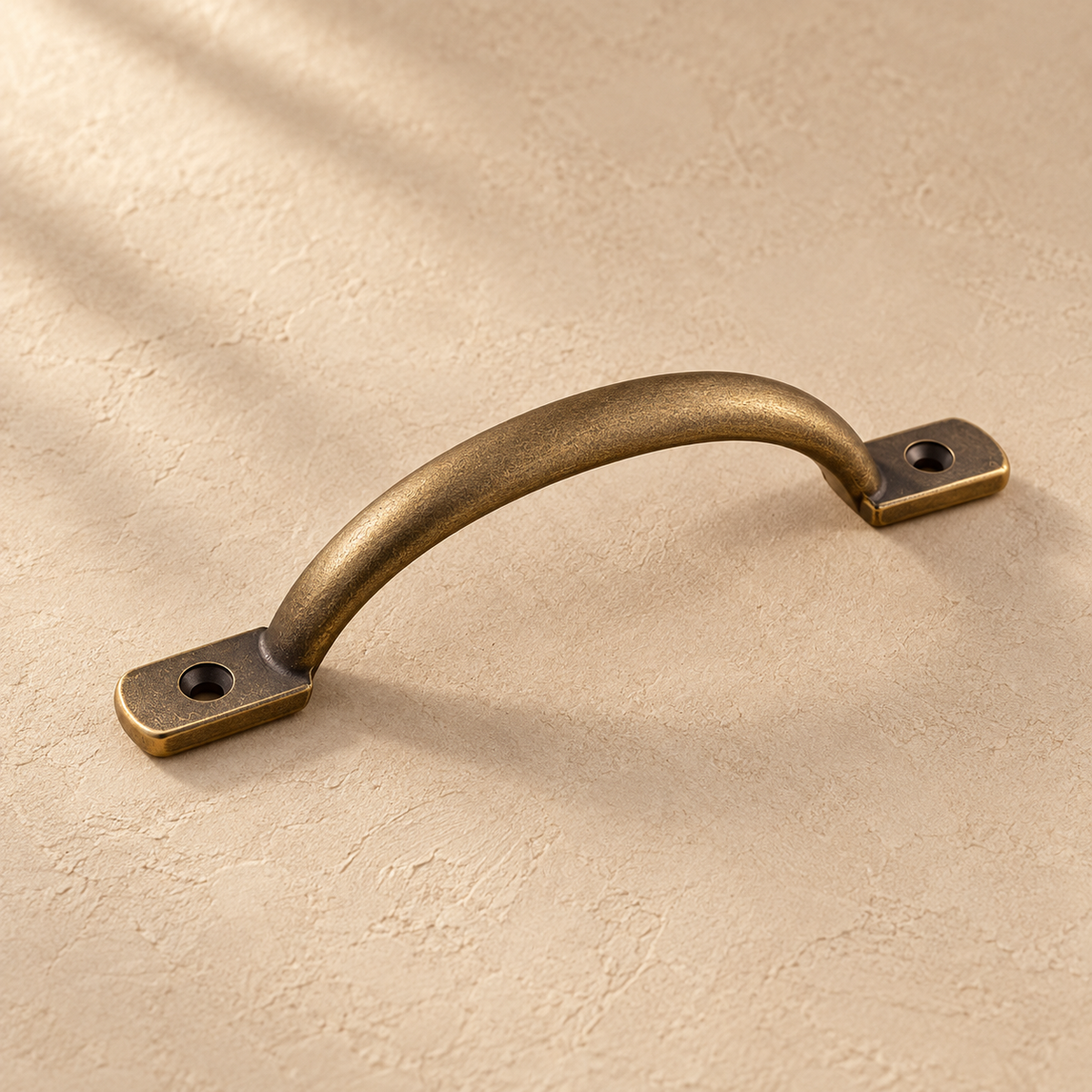 No-Drill Solid Brass Cabinet Pull — Antique Brass on a warm ivory background