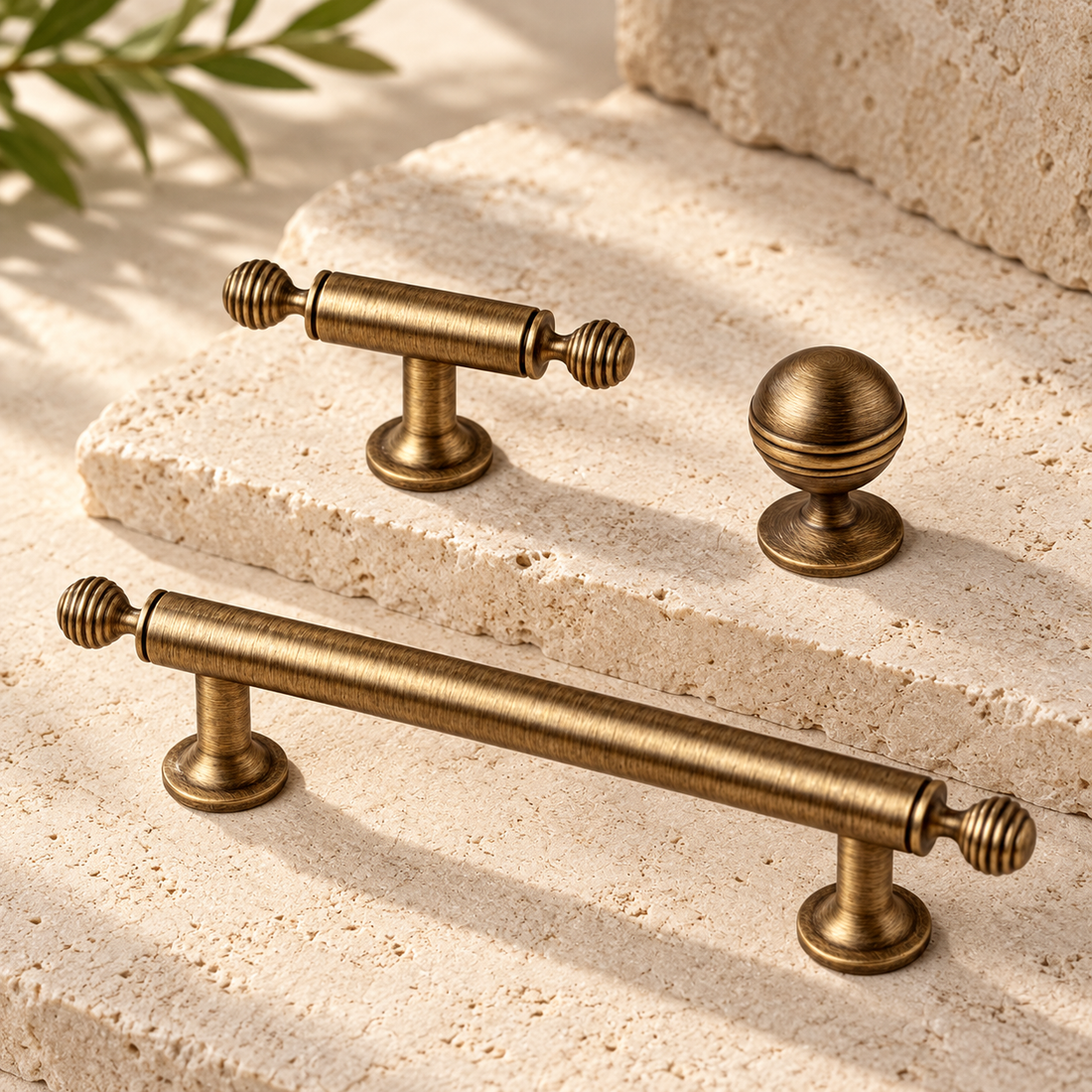 Antique Brass Ribbed Cabinet Pulls & Knobs — Solid Brass Hardware on warm ivory stone
