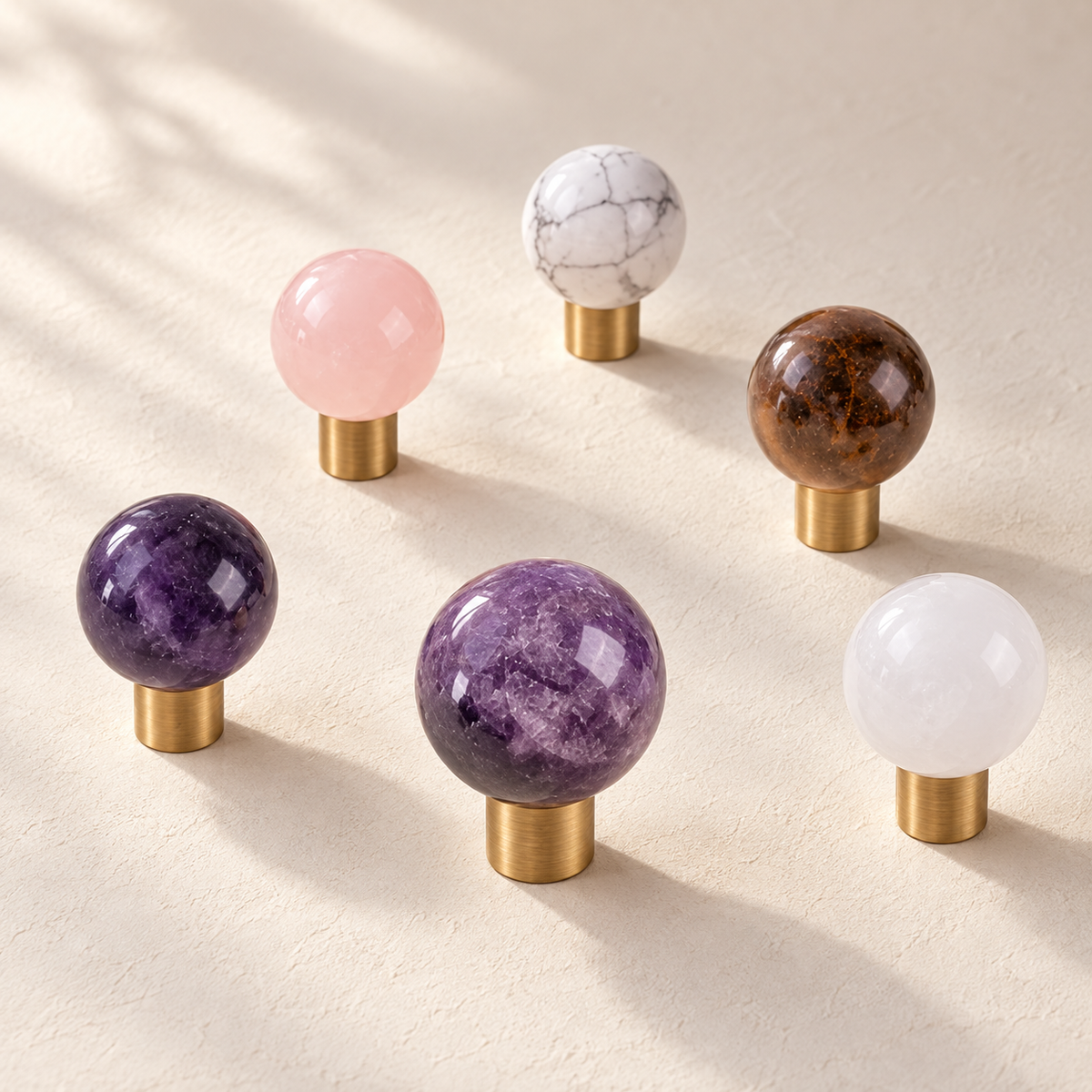 Solid Brass Crystal Cabinet Knobs — Antique Brass on a warm ivory background