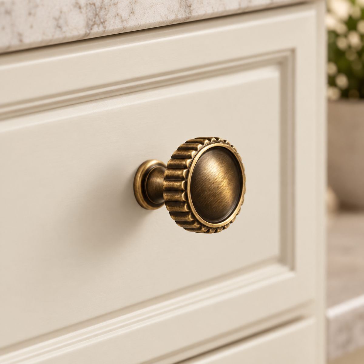 Antique Brass Solid Brass Cabinet Pulls & Knobs — Modern Pipe Design installed on warm ivory cabinetry