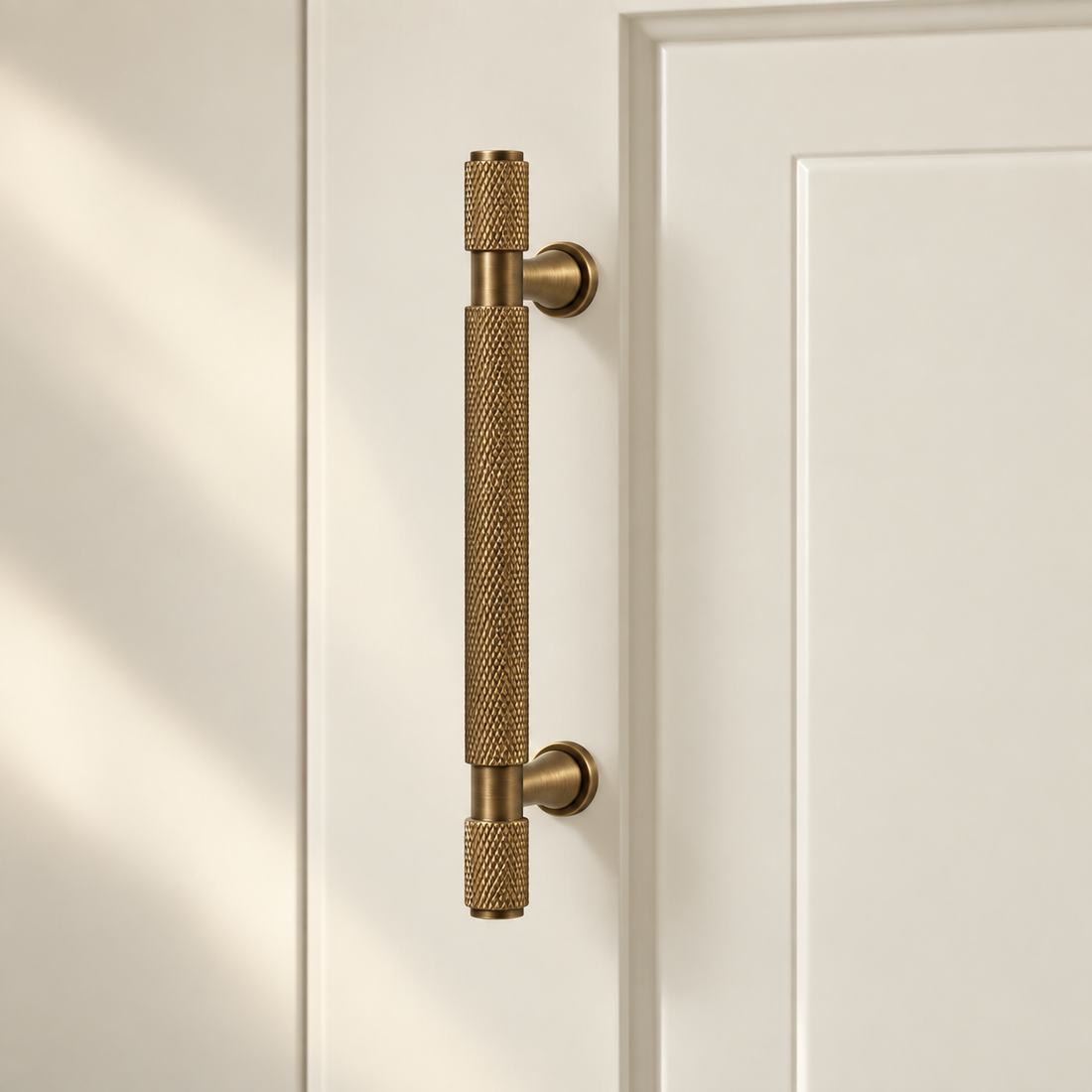 Antique Brass Solid Brass Knurled Cabinet Pulls & Knobs — Cross Pattern Design on warm ivory stone