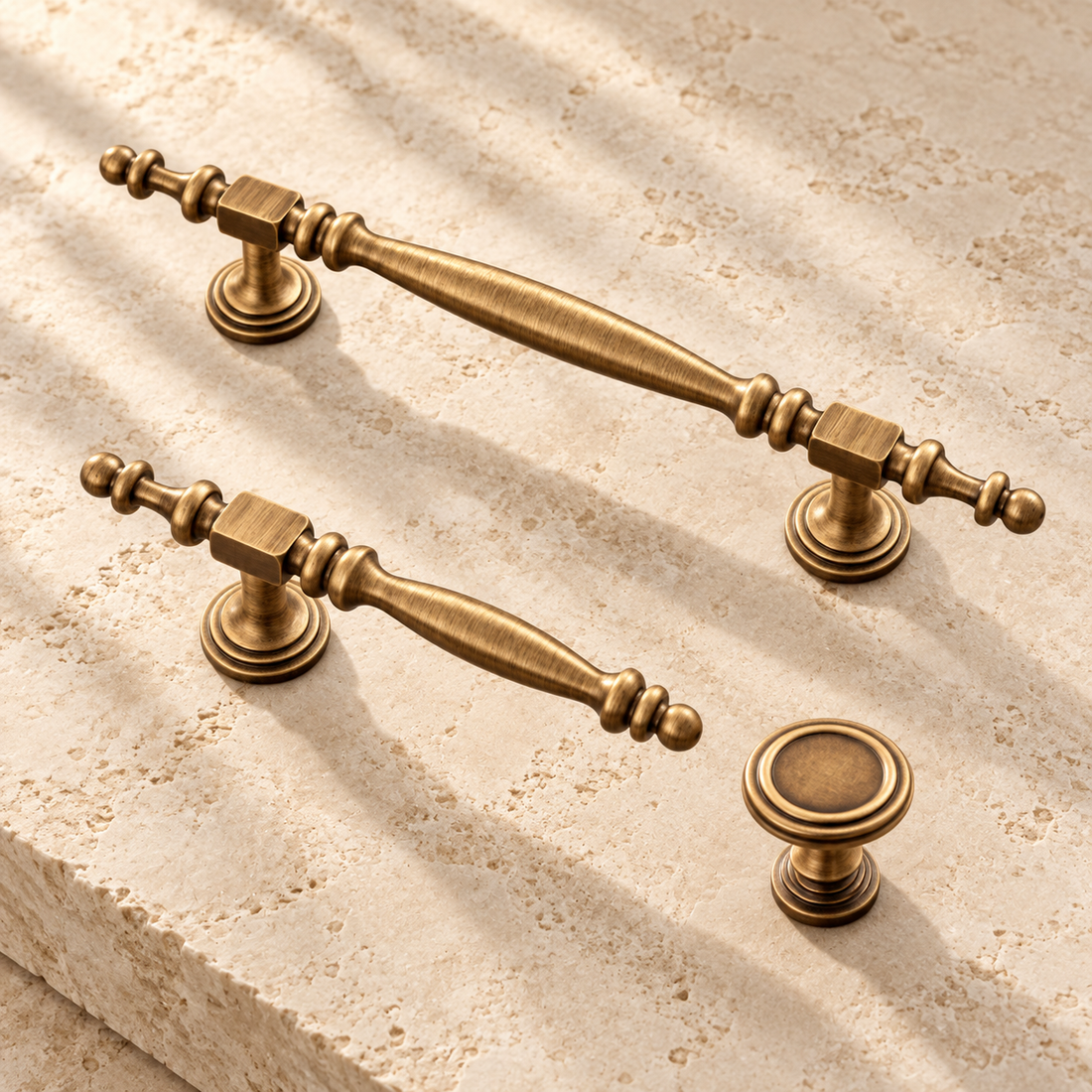 Beaded Column Cabinet Pull & Knob — Antique Brass on warm ivory stone