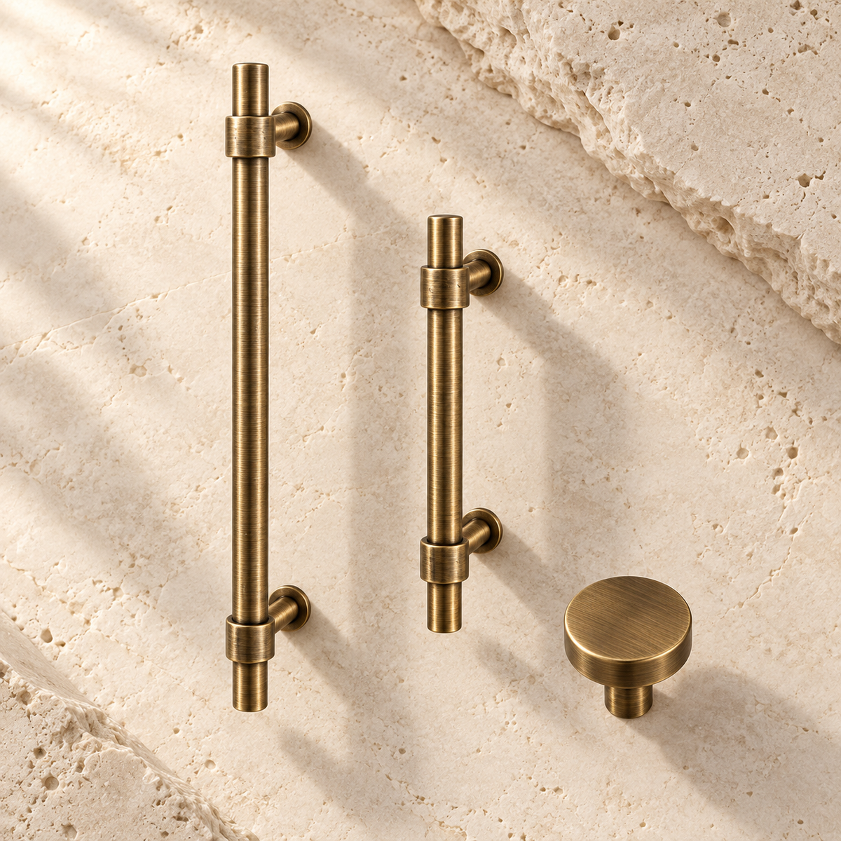 Antique Brass Solid Brass Cabinet Pulls & Knobs — Simple Modern Design on warm ivory stone