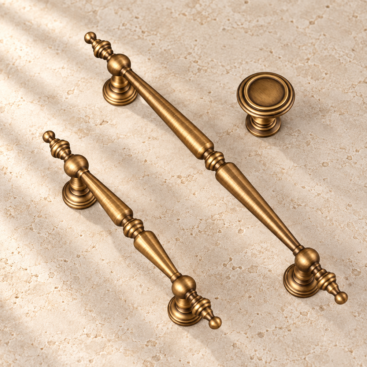 Antique Brass Solid Brass Cabinet Pulls & Knobs — Classic Turret Design on warm ivory stone