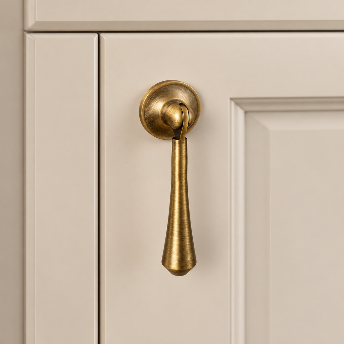 Brushed Antique Brass Cabinet Handle & Knob — Tear Drop Design on warm ivory stone