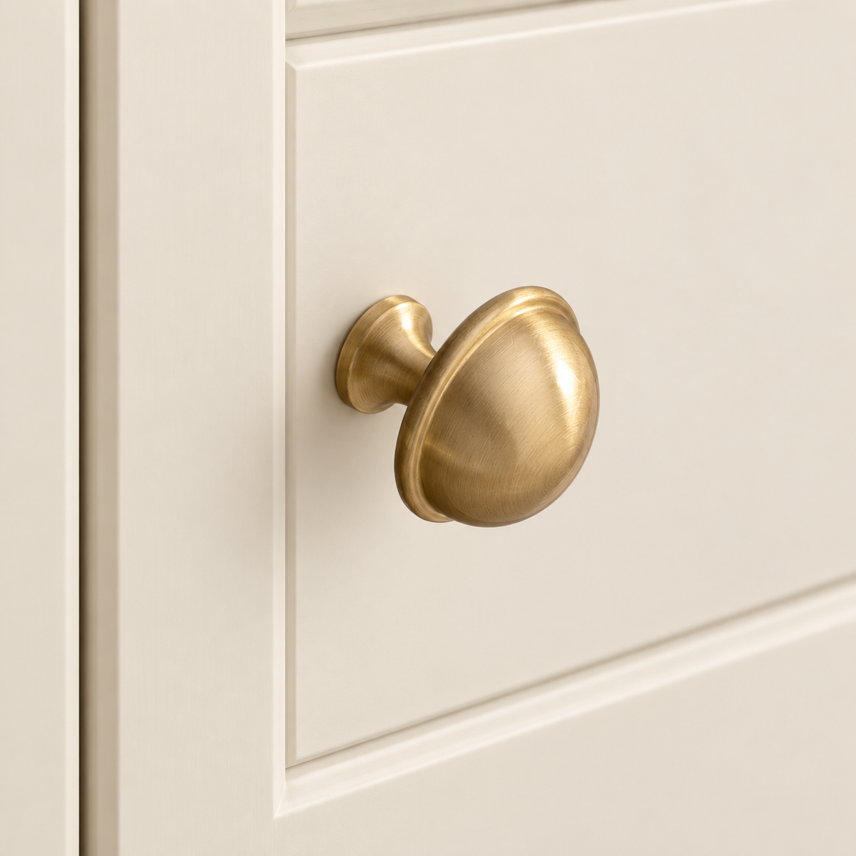 Brushed Brass Crown Design Cabinet Pull & Knob — Solid Brass installed on warm ivory cabinetry