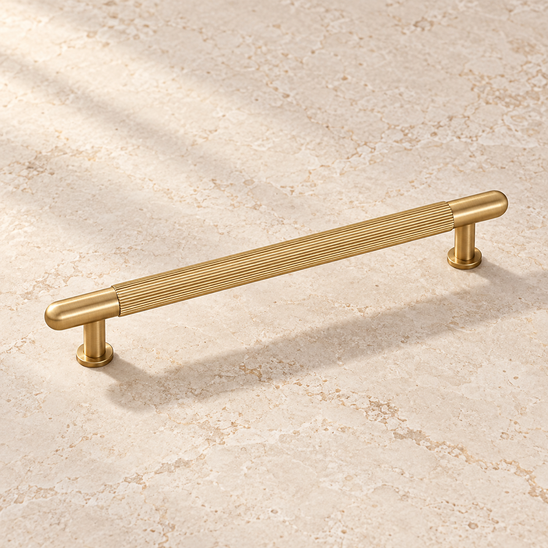 Brushed Brass Ribbed Cabinet Pull — Solid Brass on warm ivory stone