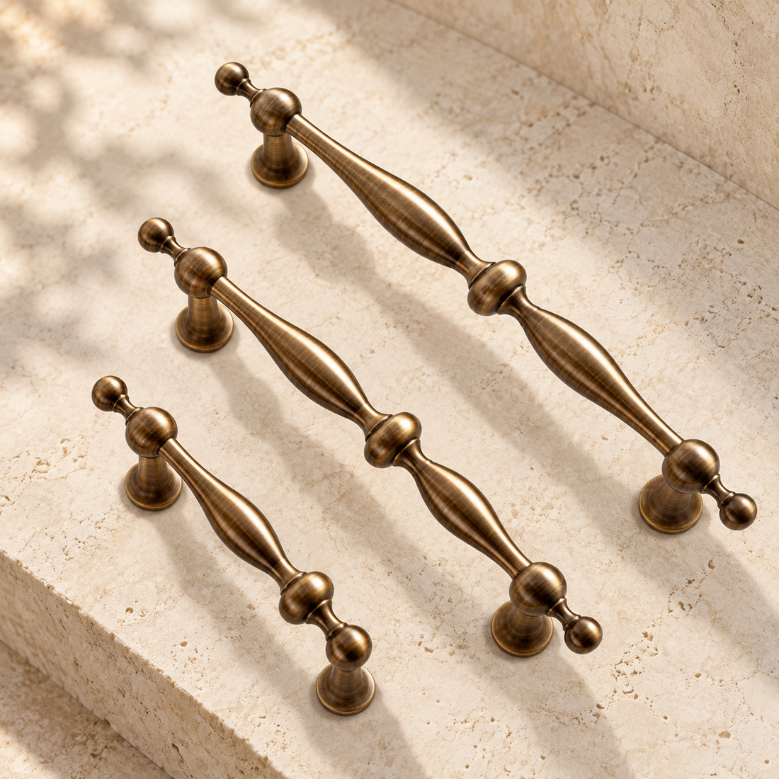 Beaded Spindle Cabinet Pull & Knob — Antique Bronze on warm ivory stone