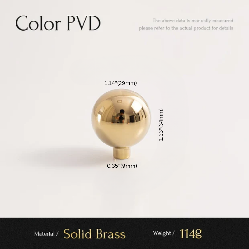 Gold spherical object with measurements on a white background