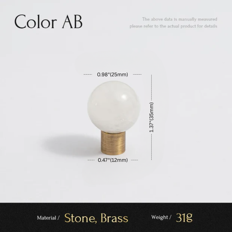 White spherical object with brass base and measurements on a light gray background