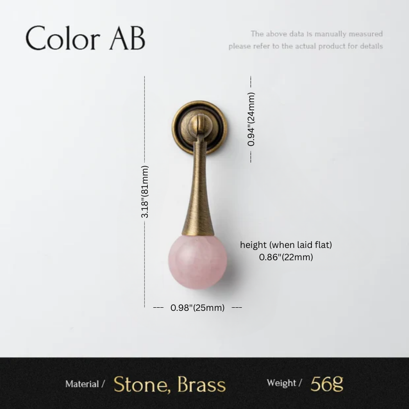 Door handle with pink stone and brass finish, showing measurements and material details.