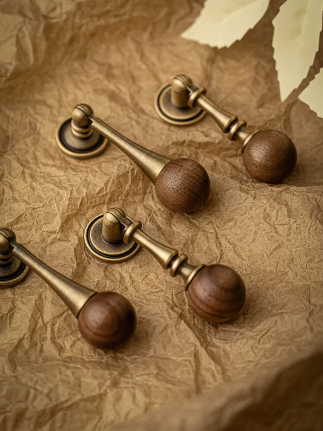 Decorative drawer pulls with gemstone knobs on a textured surface, featuring the Santaya brand.
