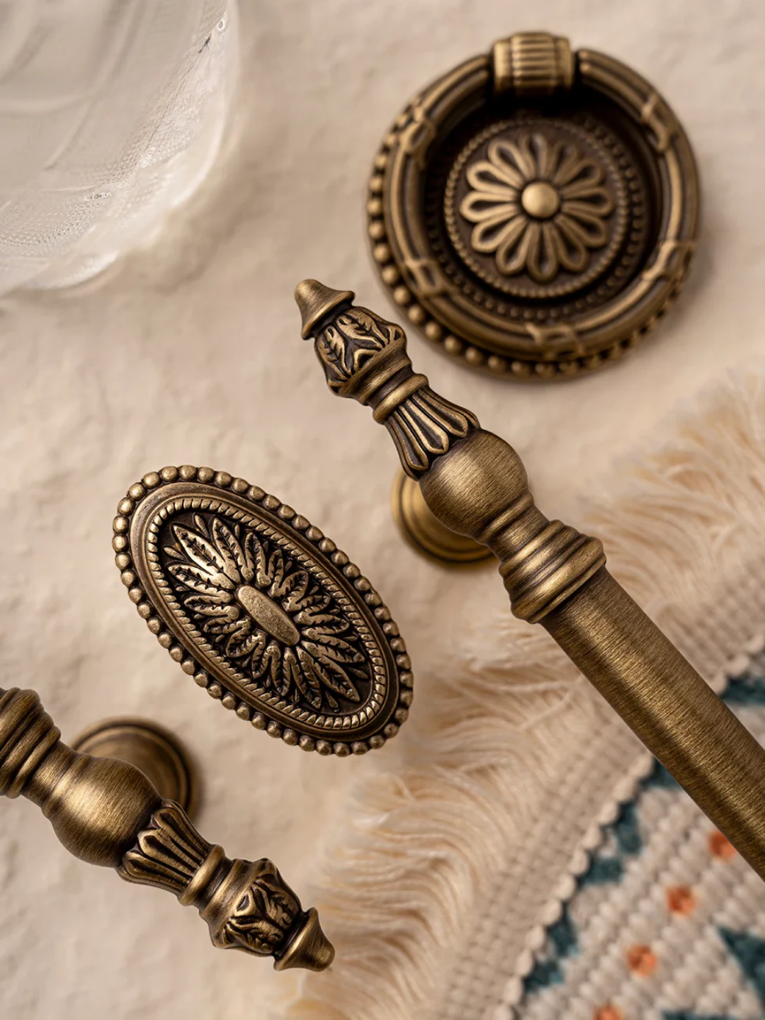 Bronze hardware fixtures on a textured surface