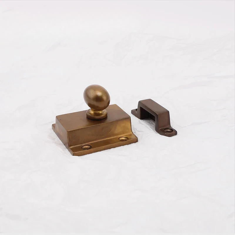 Bronze door handle and lock mechanism on a white background