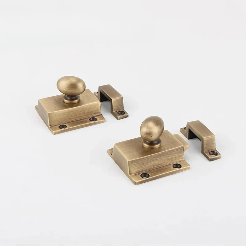 Set of brass door handles on a white background