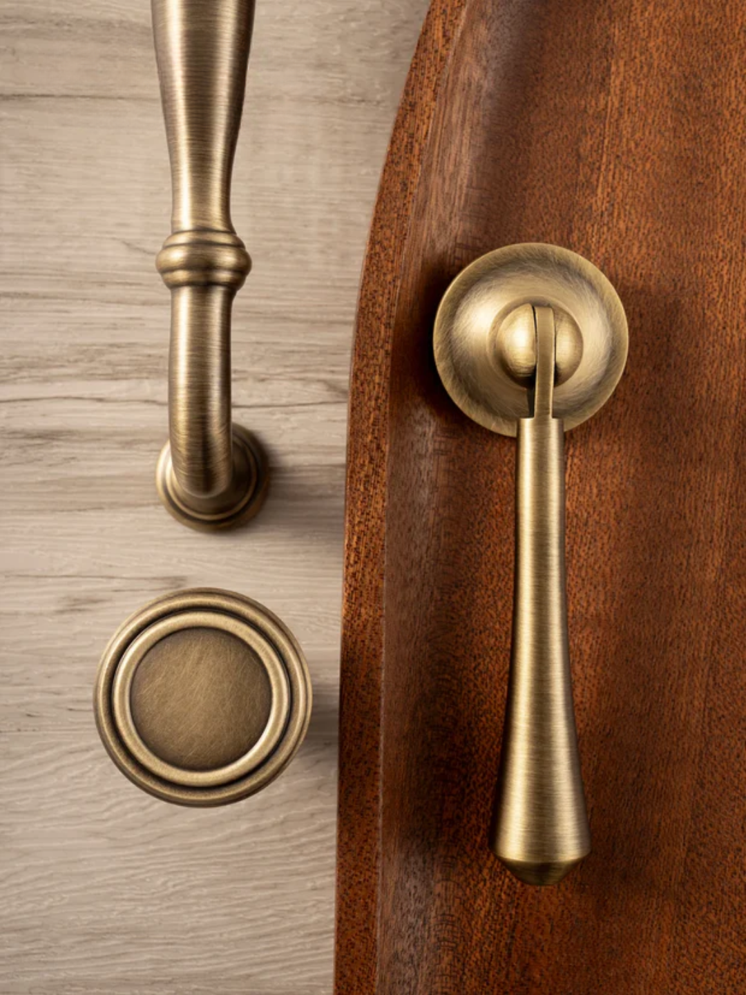 Close-up of brass door handles on wooden and metallic doors